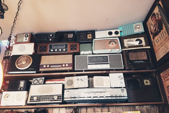 assorted radio collection on rack