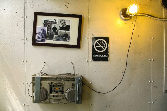 gray and black radio on white wall
